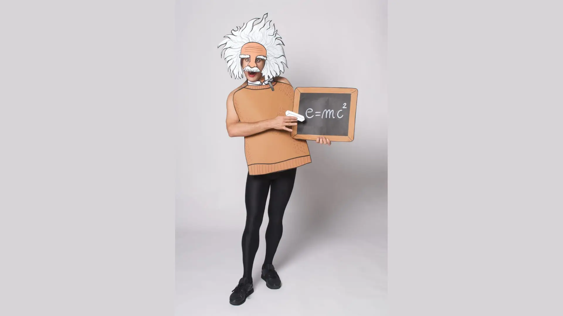 Ennio as a wild-haired scientist holding a chalkboard