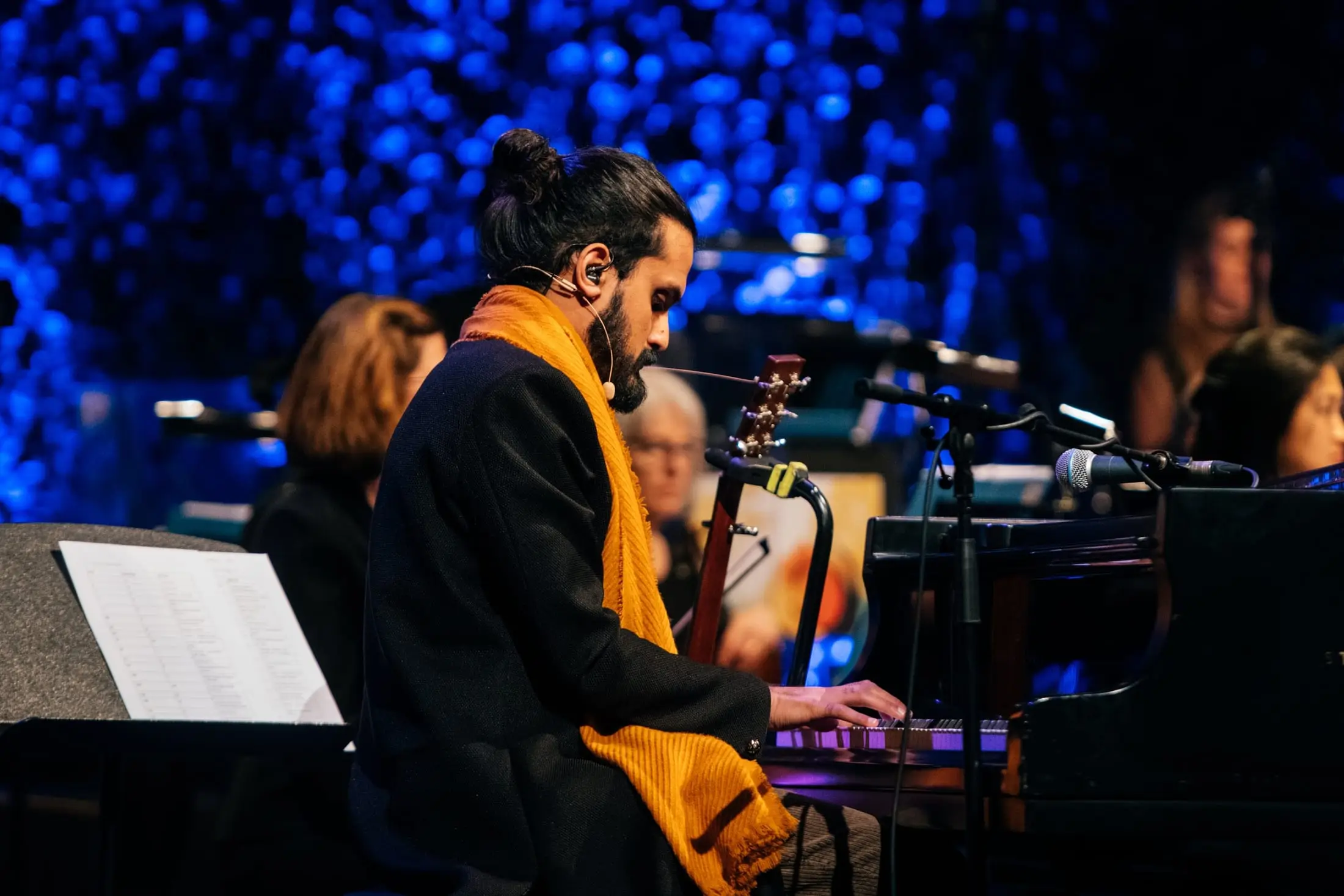 Rushil Ranjan at the harmonium in a yellow scarf