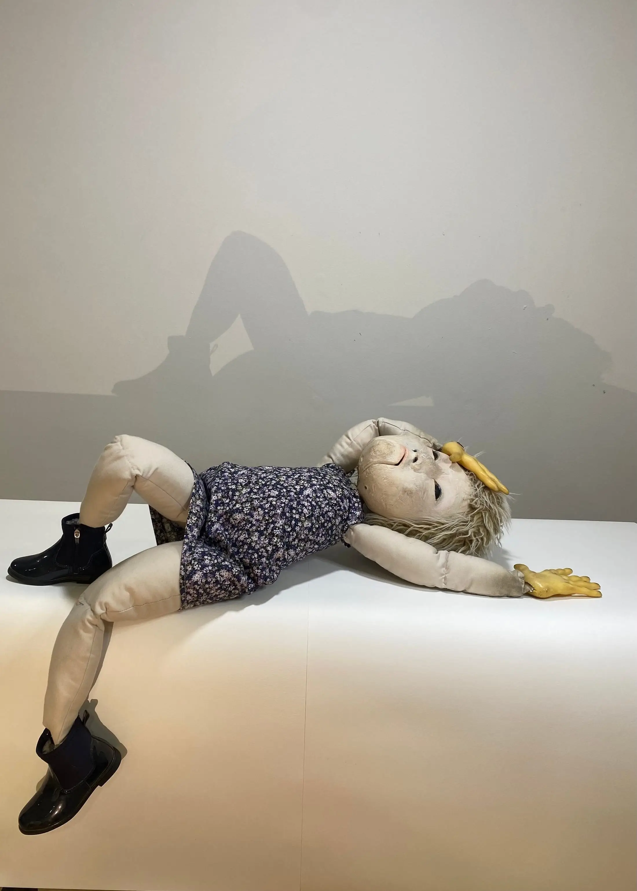 A puppet lying on the floor in a studio